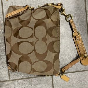 Brown and tan canvas hobo bag with light tan leather accents
